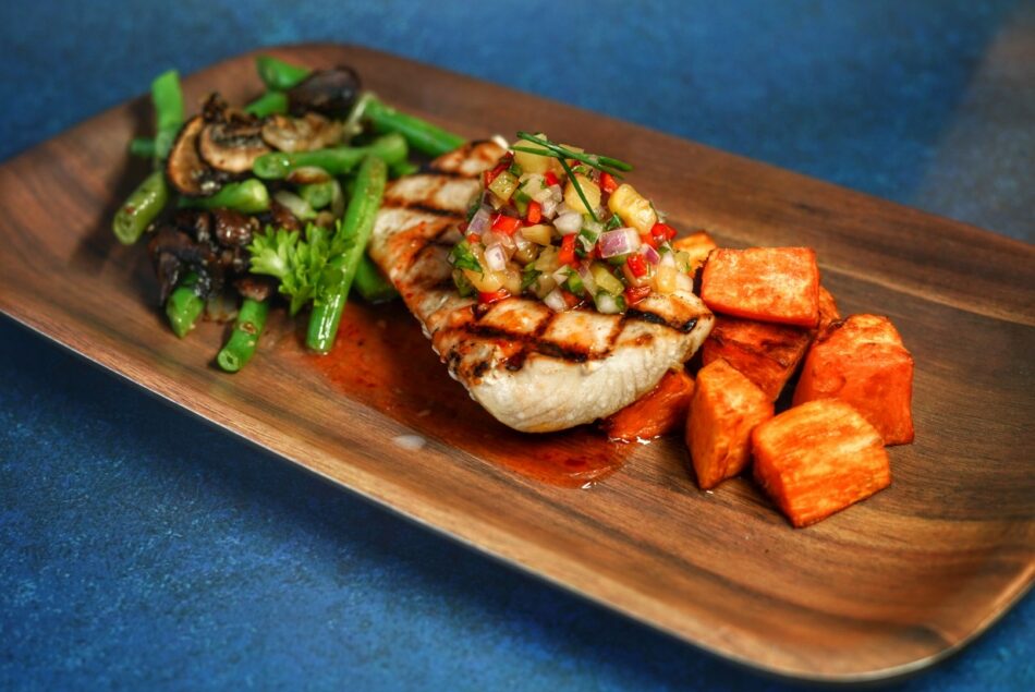 Grilled mahi with pineapple salsa, sweet potatoes, and green beans
